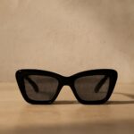 black cat eye sunglasses and black cat necklace