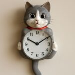 A cat clock with moving eyes and tail, highlighting cat clock eyes and tail features